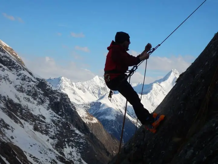 climber reaching a goal of the mountain