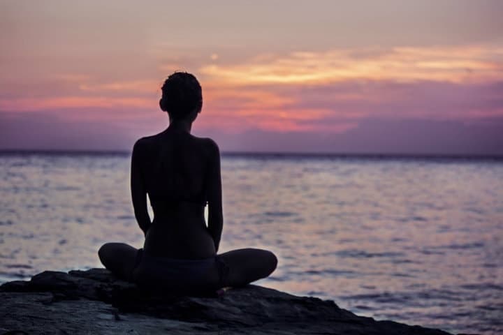 meditating at the beach