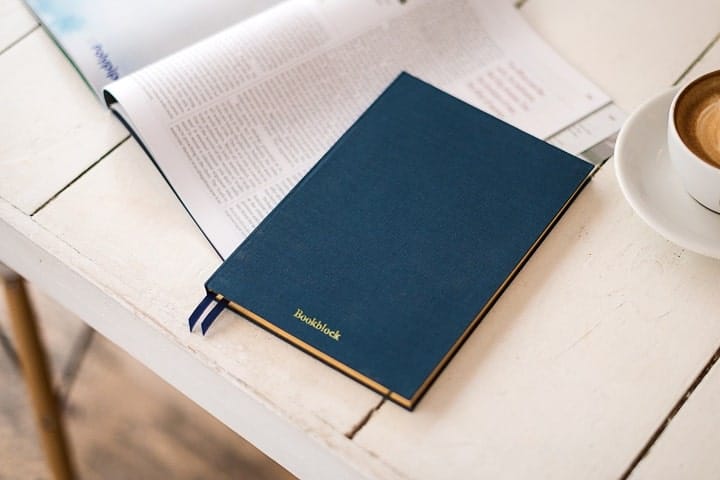 a personal book on a table with coffee