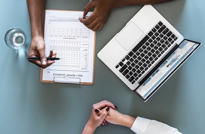 doctor with a laptop with a patient