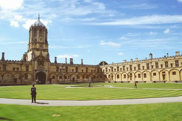 person standing at the university grass