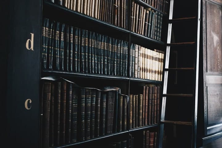 bookshelf with law books and old volumes