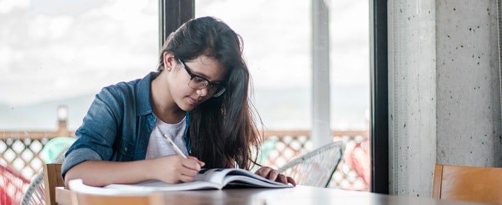 woman studying at a desk