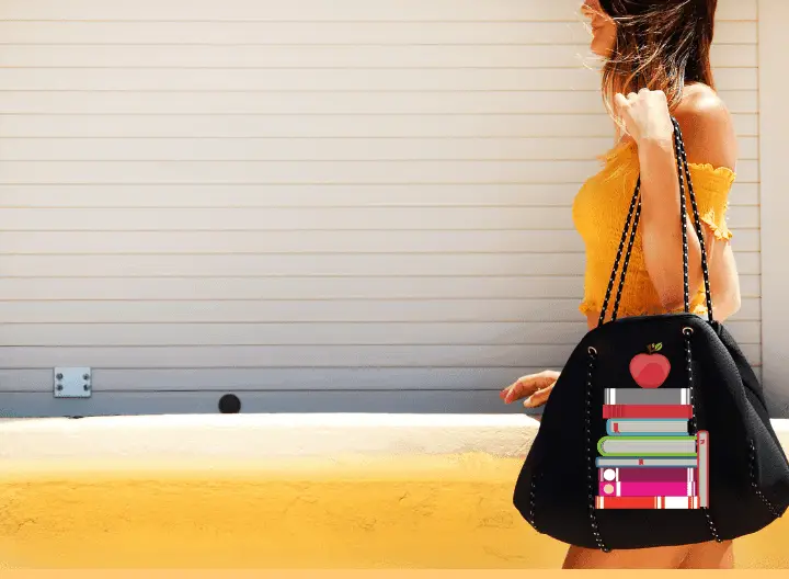 a woman with a big black bags and books