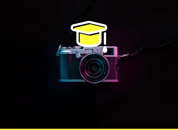 a camera with a college graduation hat on it - featured image