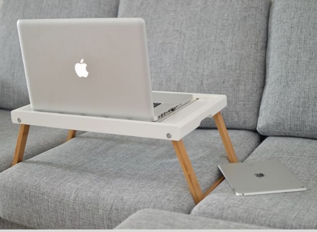 computer tray table on a couch - featured image