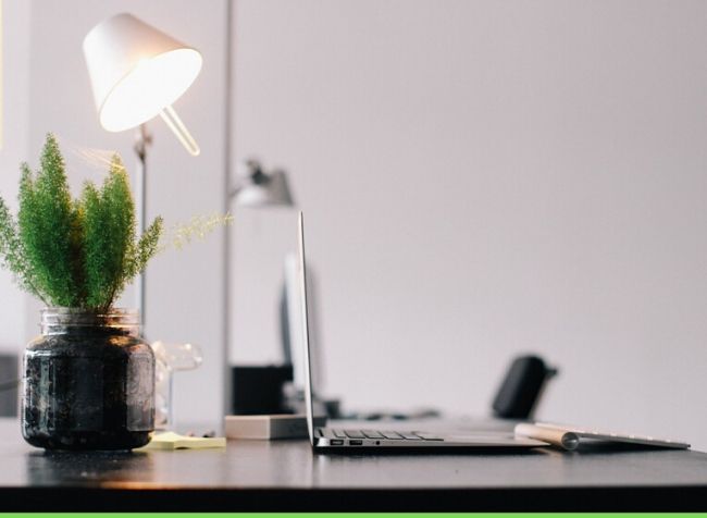 natural modern office lamp on a desk with a laptop - featured image