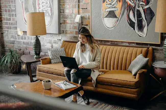 person writing in a beautiful cafe