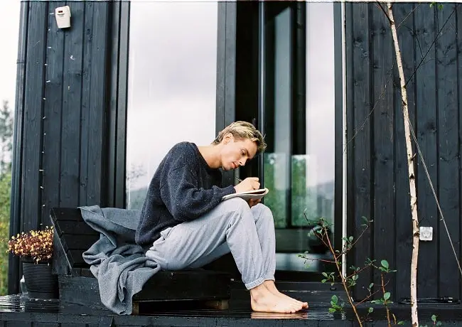 man writing outdoor