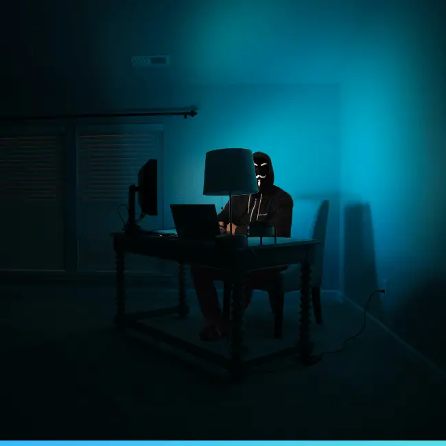 hacker in a dark room