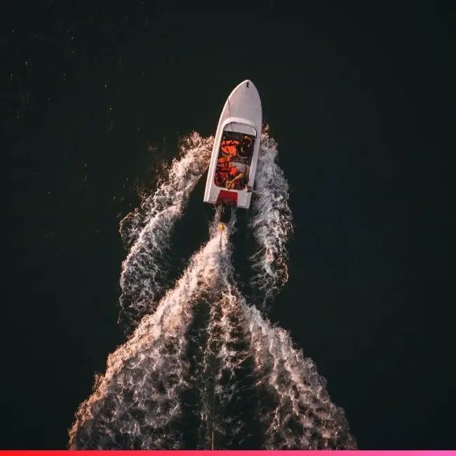 people escaping a challenging situation on a boat