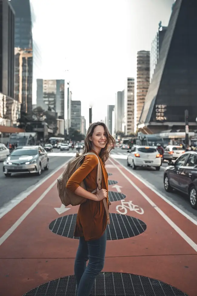 a beautiful woman with a backpack-min