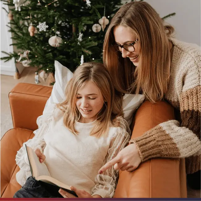 mom and a daughter celebrating a book