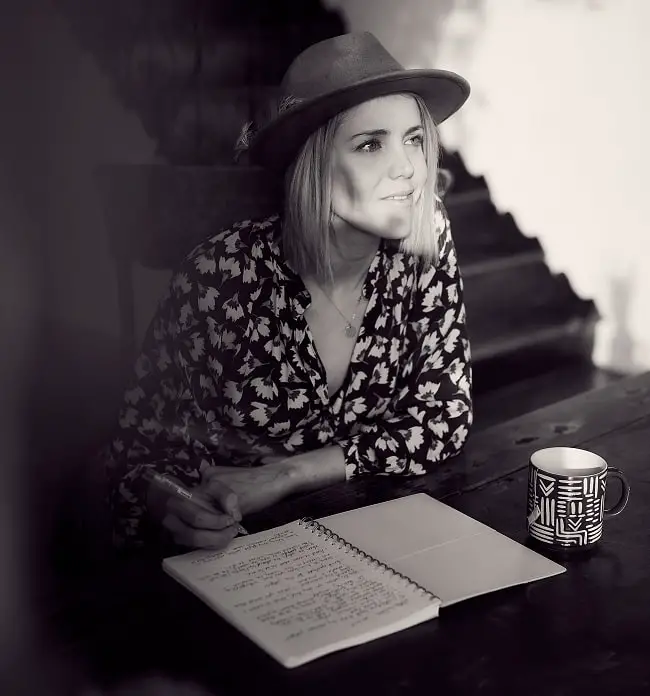 young writer at a desk with a notebook