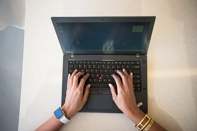freelancer typing on a keyboard