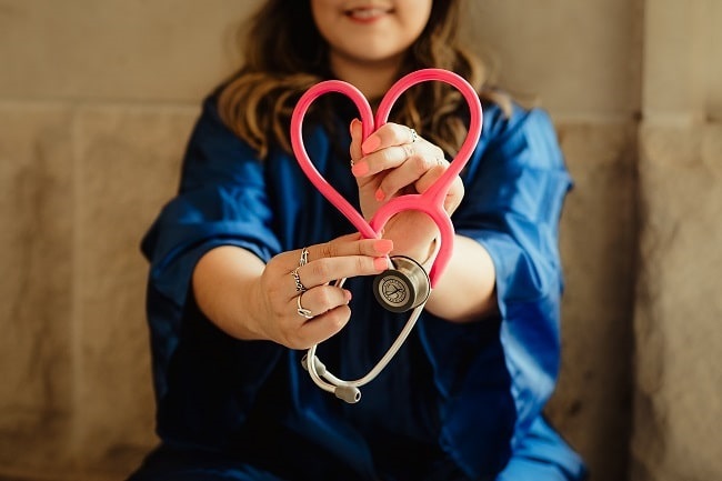 medical practitioner doing a heart symbol