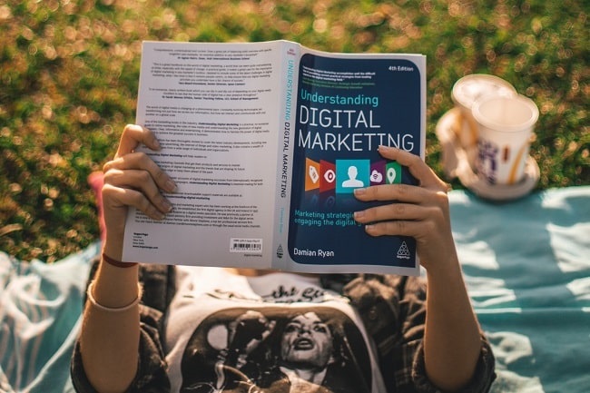 reading a book on digital marketing