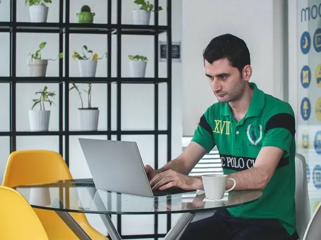 writer wearing a polo shirt