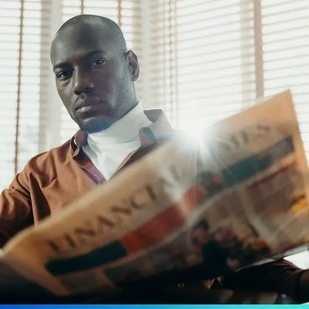 Man reading the daily column paper