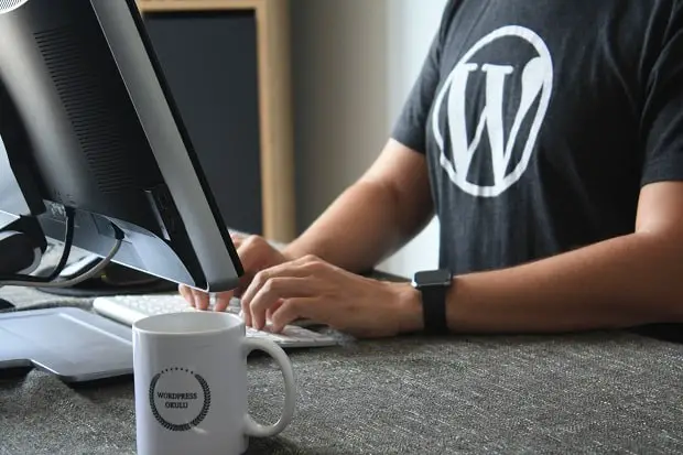 wearing t-shirt with wordpress logo