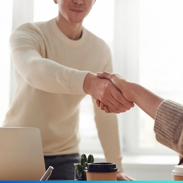 Applicant shaking hands with employer