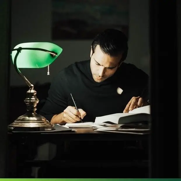 Writing under a lamp