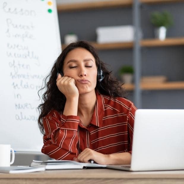 Avoid Burnout in College - bored student at a desk - featured image