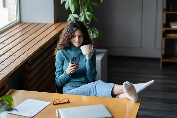 a student female procrastinating at a desk