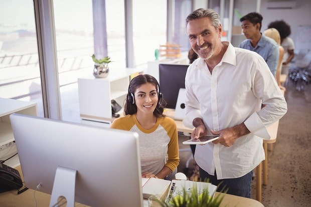 smiling business person with an assistant