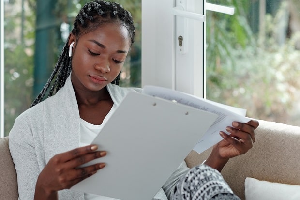 young woman reading a document