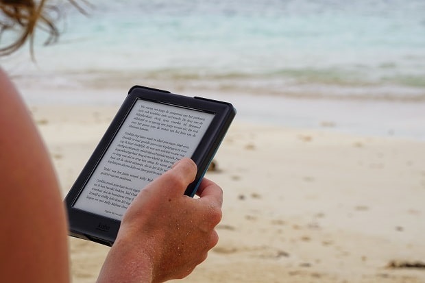 reading eBook on the beach