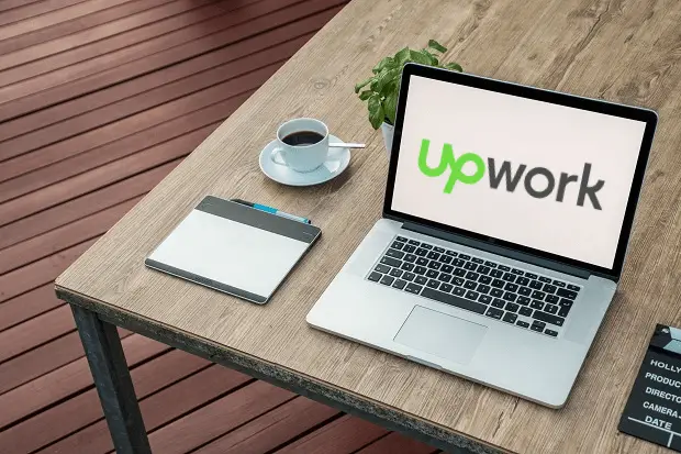 laptop with upwork logo