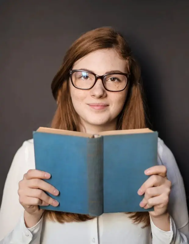 Young student reading a book