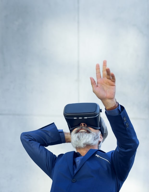 older man using virtual reality