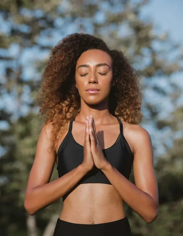 Practicing meditation and yoga outdoors