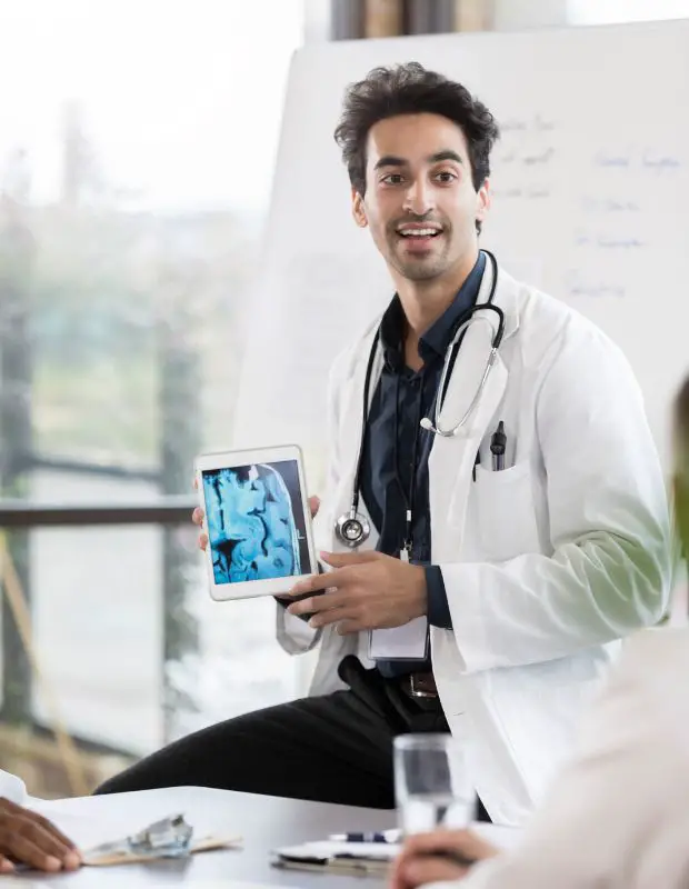 Young male doctor delivering a presentation