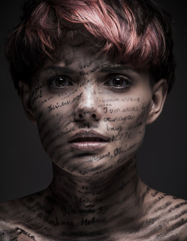 a person with words written on her face