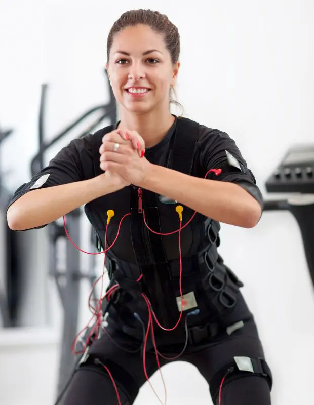 young sportswoman exercising with advanced equipment