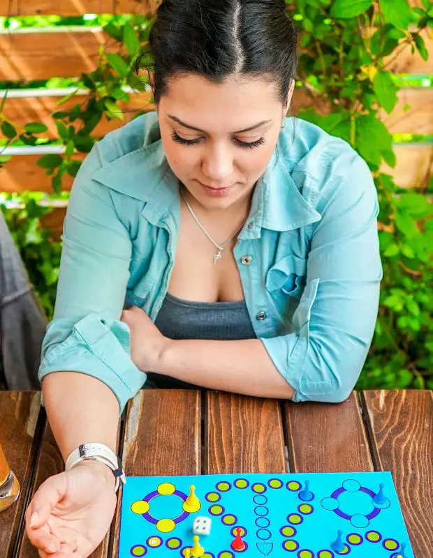 a young woman playing a board game