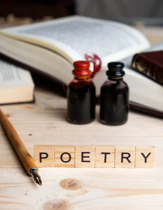 poetry letters on a table with ink and a fountain pen