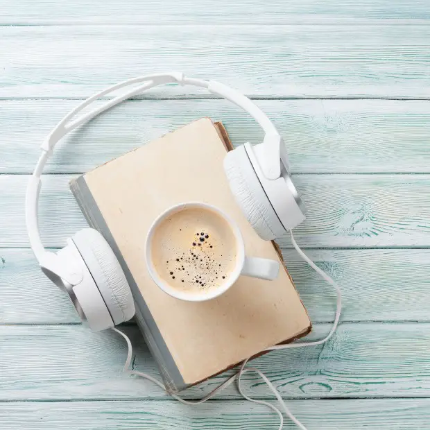 a book with headphones around it